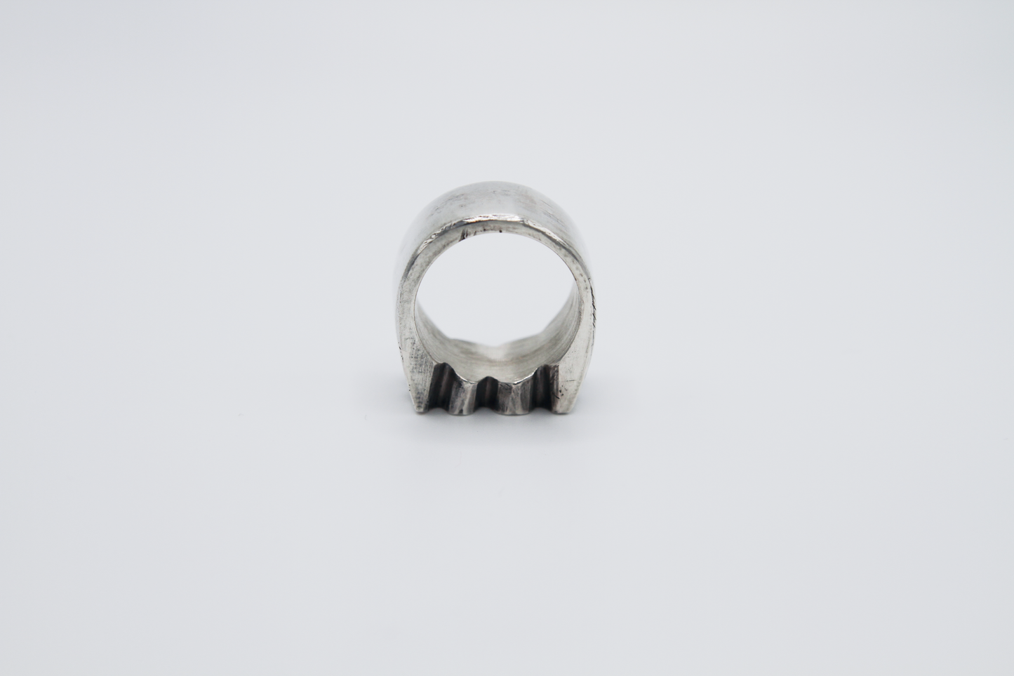 The Nibble Ring. 925 Solid Sterling Silver Chunky Ring band hand made in the United Kingdom. This ring has a wavy and unique design, displaying a wiggly edged design in the centre of the ring face. For all genders and ring sizes.