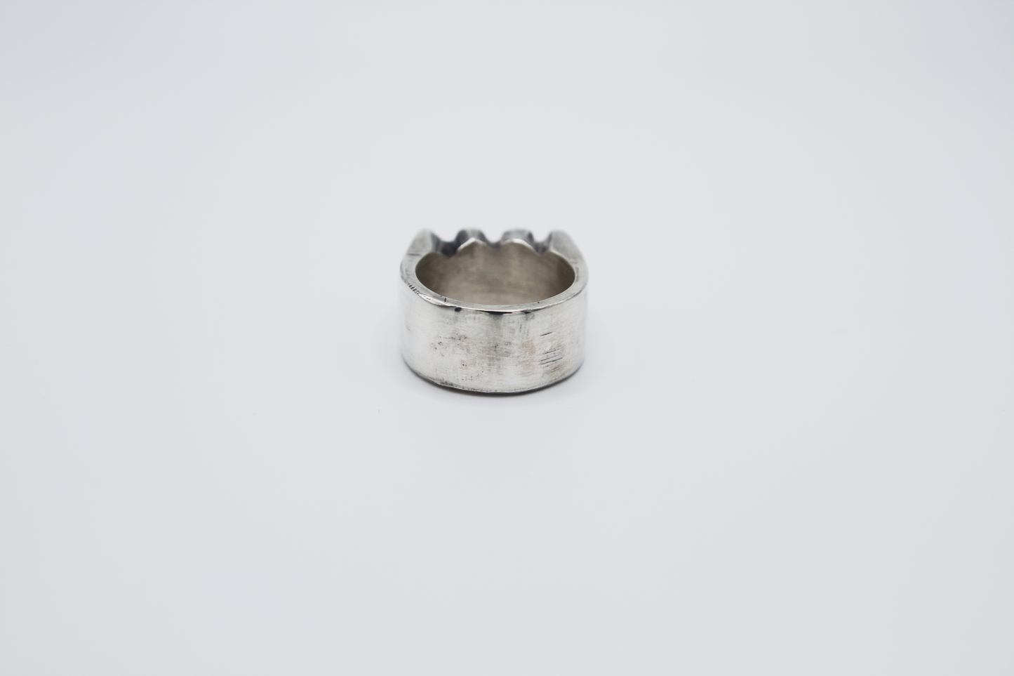 The Nibble Ring. 925 Solid Sterling Silver Chunky Ring band hand made in the United Kingdom. This ring has a wavy and unique design, displaying a wiggly edged design in the centre of the ring face. For all genders and ring sizes.