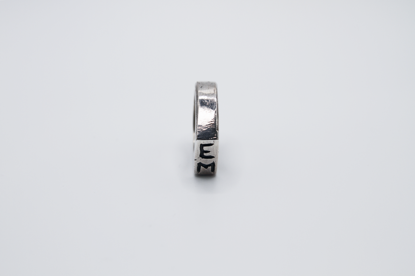 The Rough Cut Initials Ring. 925 Solid Sterling Silver Chunky Ring band hand made in the United Kingdom. This Signet ring is designed to sit on your pinky finger as they are classicaly worn. Put your initials in places of a coat of arms. For all genders and ring sizes.