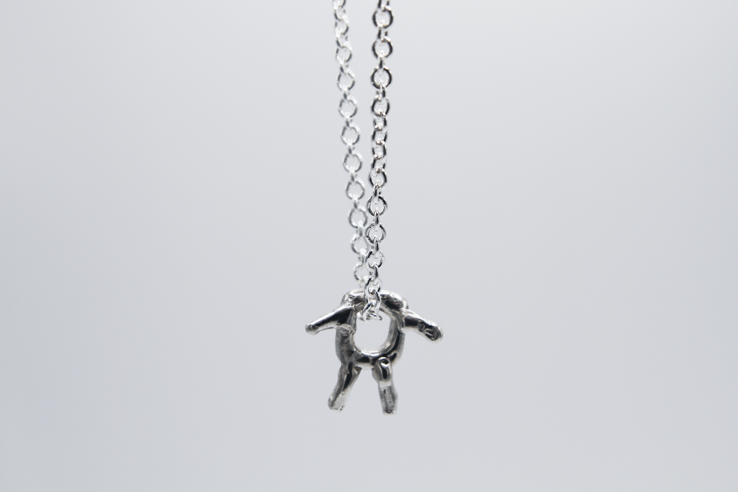 The Square Boy Pendant Necklace. 925 Solid Sterling Silver Pendant Necklace hand made in the United Kingdom. This necklace displays a Square pendant with arms and legs in solid sterling silver. This pendant sits on an 18 inch trace chain. For all genders.