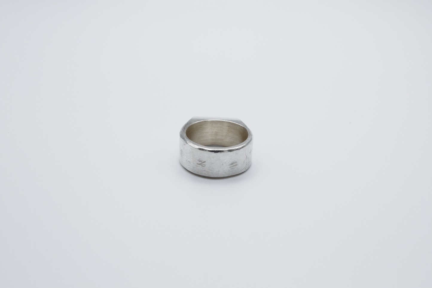 The Doodle Signet Ring. 925 Solid Sterling Silver Chunky Ring band hand made in the United Kingdom. This ring has a classic flat face displaying a wiggly and unique doodle design in the shape of a box on the front of the ring. For all genders and ring sizes.
