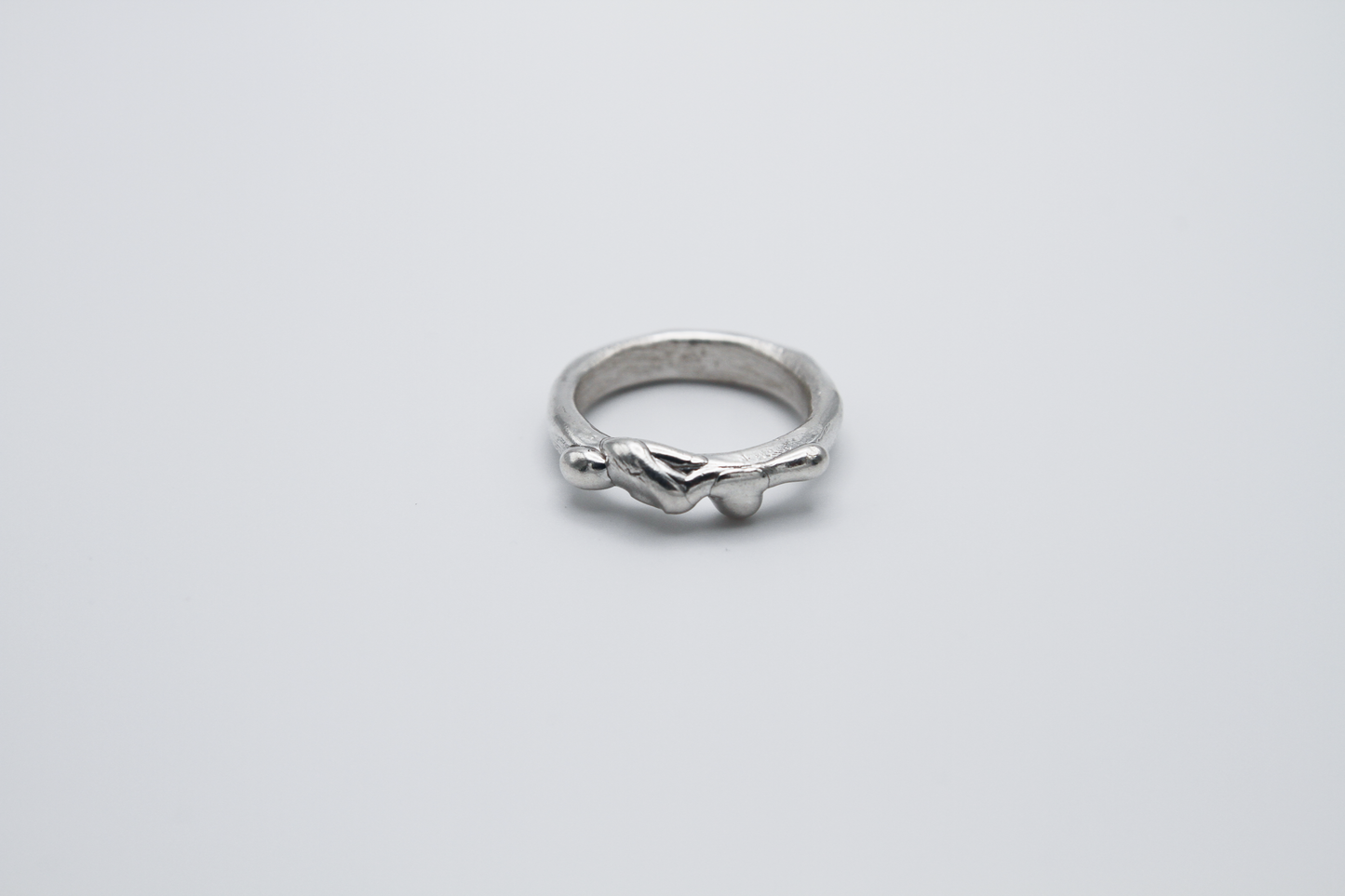 The Treacle Ring Band. 925 Solid Sterling Silver Ring band hand made in the United Kingdom. This ring has a melted look to it, driping sterling silver on the ring face. For all genders and ring sizes.