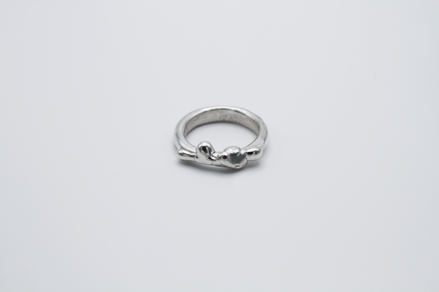 The Treacle Ring Band. 925 Solid Sterling Silver Ring band hand made in the United Kingdom. This ring has a melted look to it, driping sterling silver on the ring face. For all genders and ring sizes.