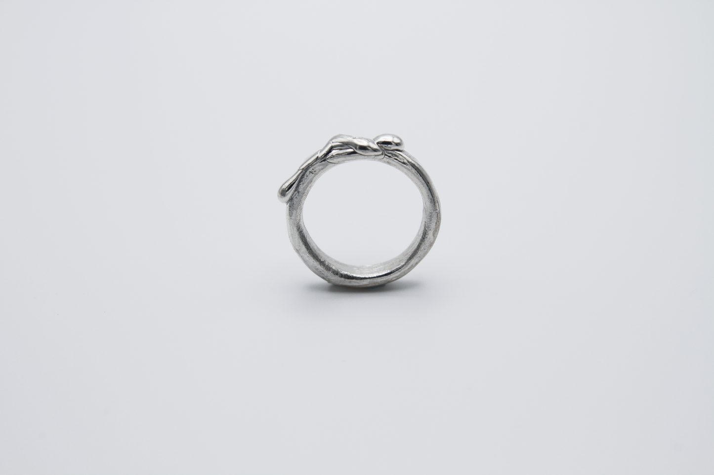 The Treacle Ring Band. 925 Solid Sterling Silver Ring band hand made in the United Kingdom. This ring has a melted look to it, driping sterling silver on the ring face. For all genders and ring sizes.