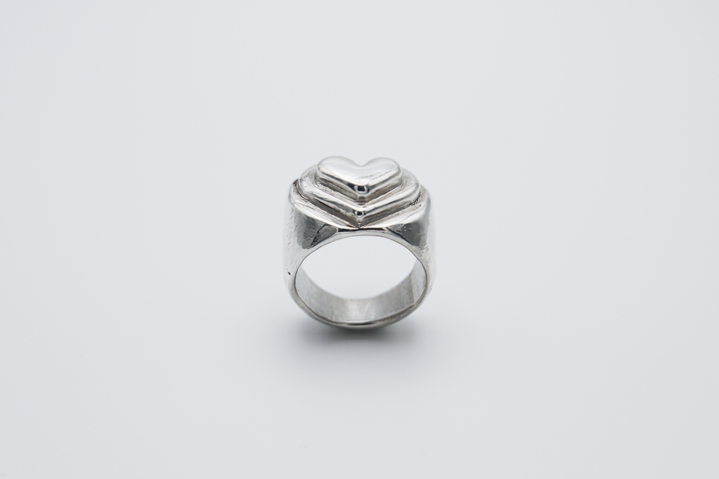 The Hill of Hearts Ring. 925 Solid Sterling Silver Chunky Ring hand made in the United Kingdom. This ring is made up of 3 tiers in a heart shape carved by hand from wax and then cast into sterling silver. For all genders and ring sizes.