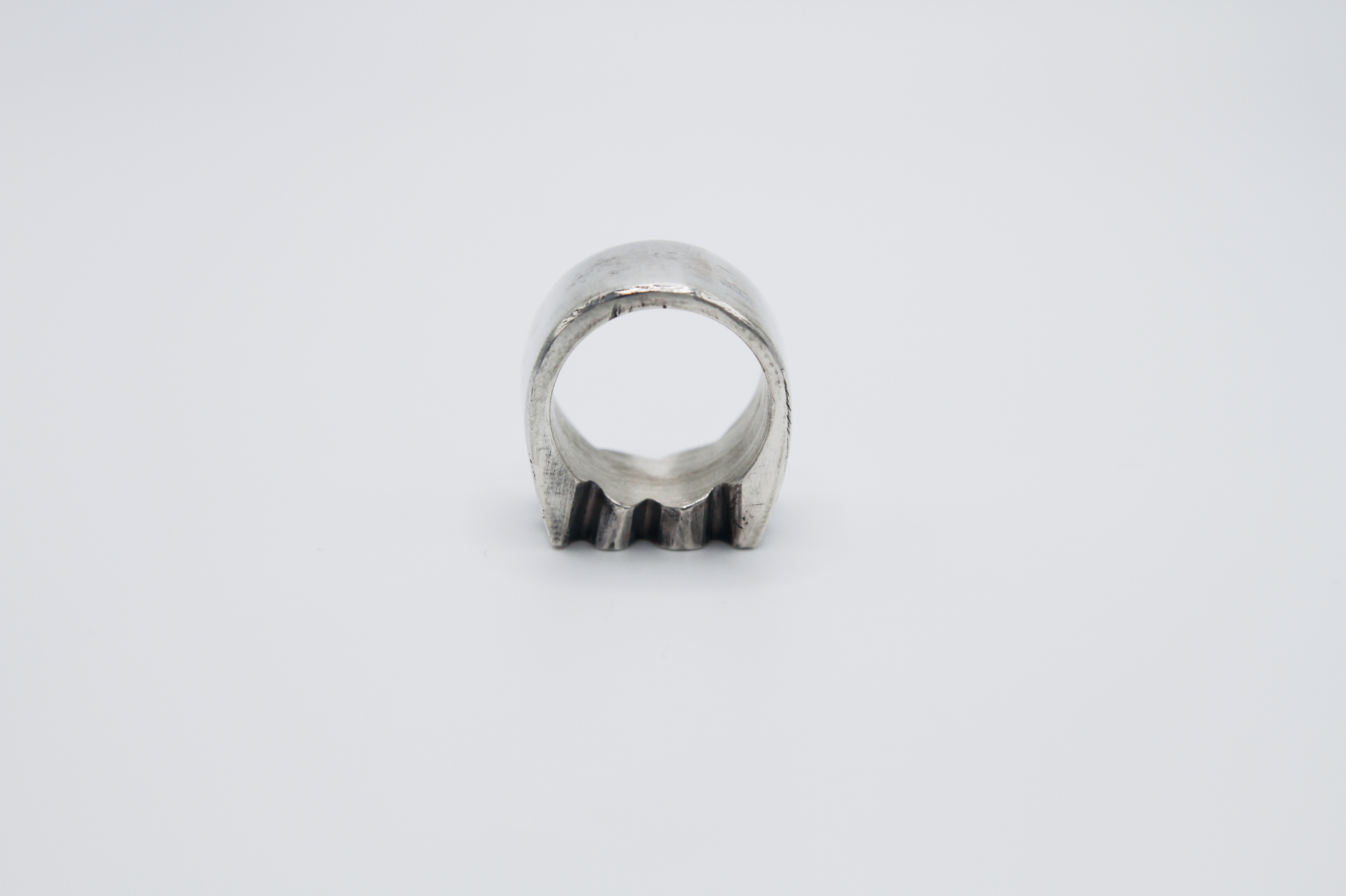 The Nibble Ring. 925 Solid Sterling Silver Chunky Ring band hand made in the United Kingdom. This ring has a wavy and unique design, displaying a wiggly edged design in the centre of the ring face. For all genders and ring sizes.