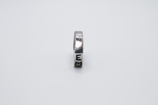 The Rough Cut Initials Ring. 925 Solid Sterling Silver Chunky Ring band hand made in the United Kingdom. This Signet ring is designed to sit on your pinky finger as they are classicaly worn. Put your initials in places of a coat of arms. For all genders and ring sizes.