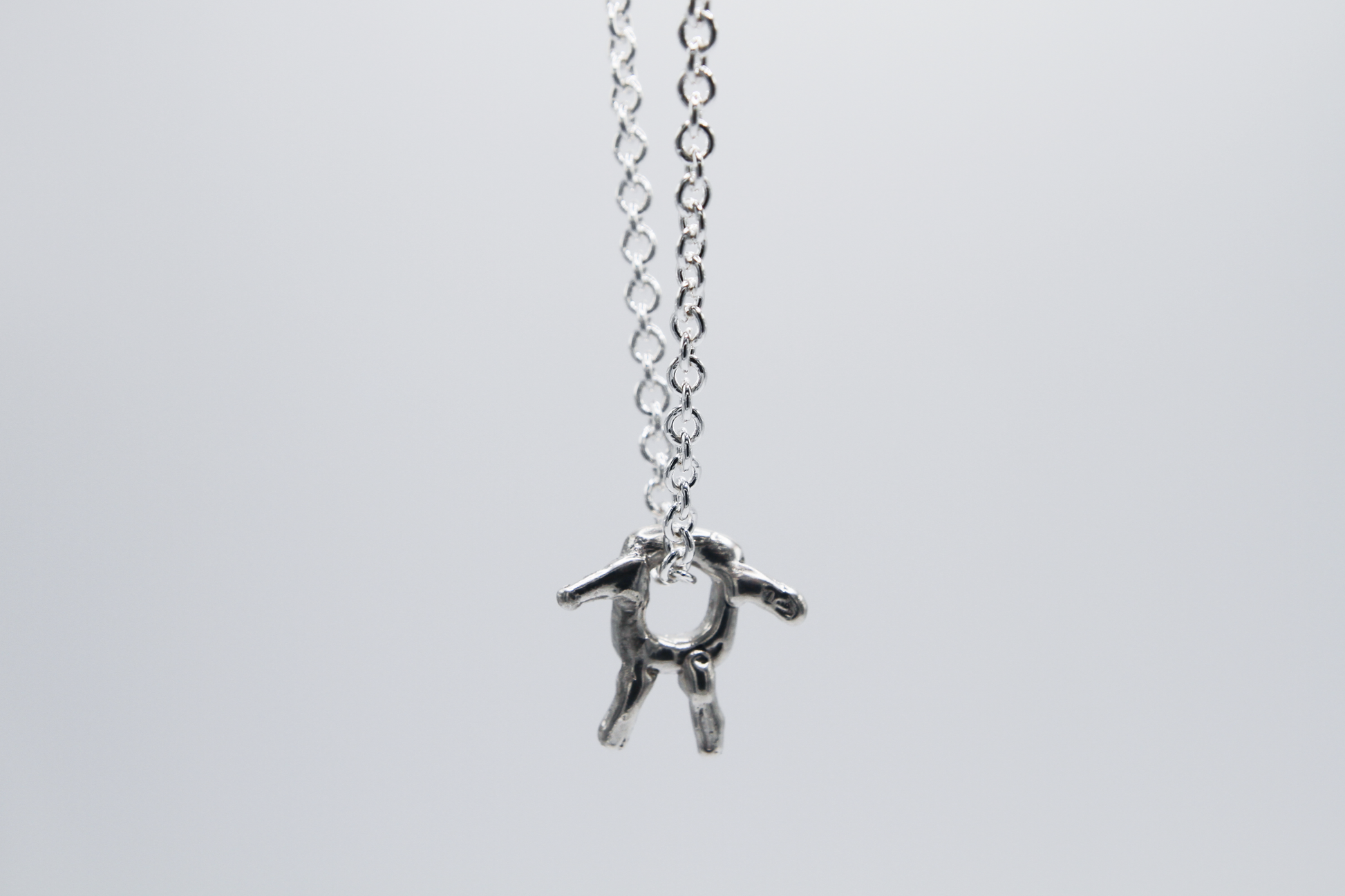 The Square Boy Pendant Necklace. 925 Solid Sterling Silver Pendant Necklace hand made in the United Kingdom. This necklace displays a Square pendant with arms and legs in solid sterling silver. This pendant sits on an 18 inch trace chain. For all genders.