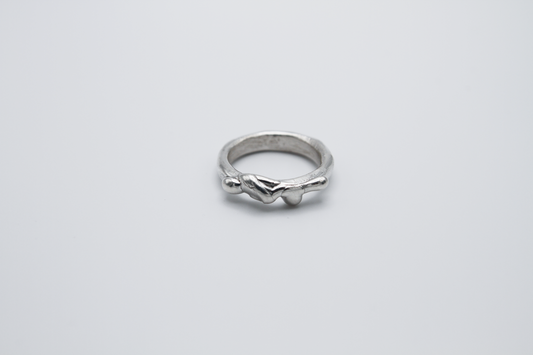 The Treacle Ring Band. 925 Solid Sterling Silver Ring band hand made in the United Kingdom. This ring has a melted look to it, driping sterling silver on the ring face. For all genders and ring sizes.