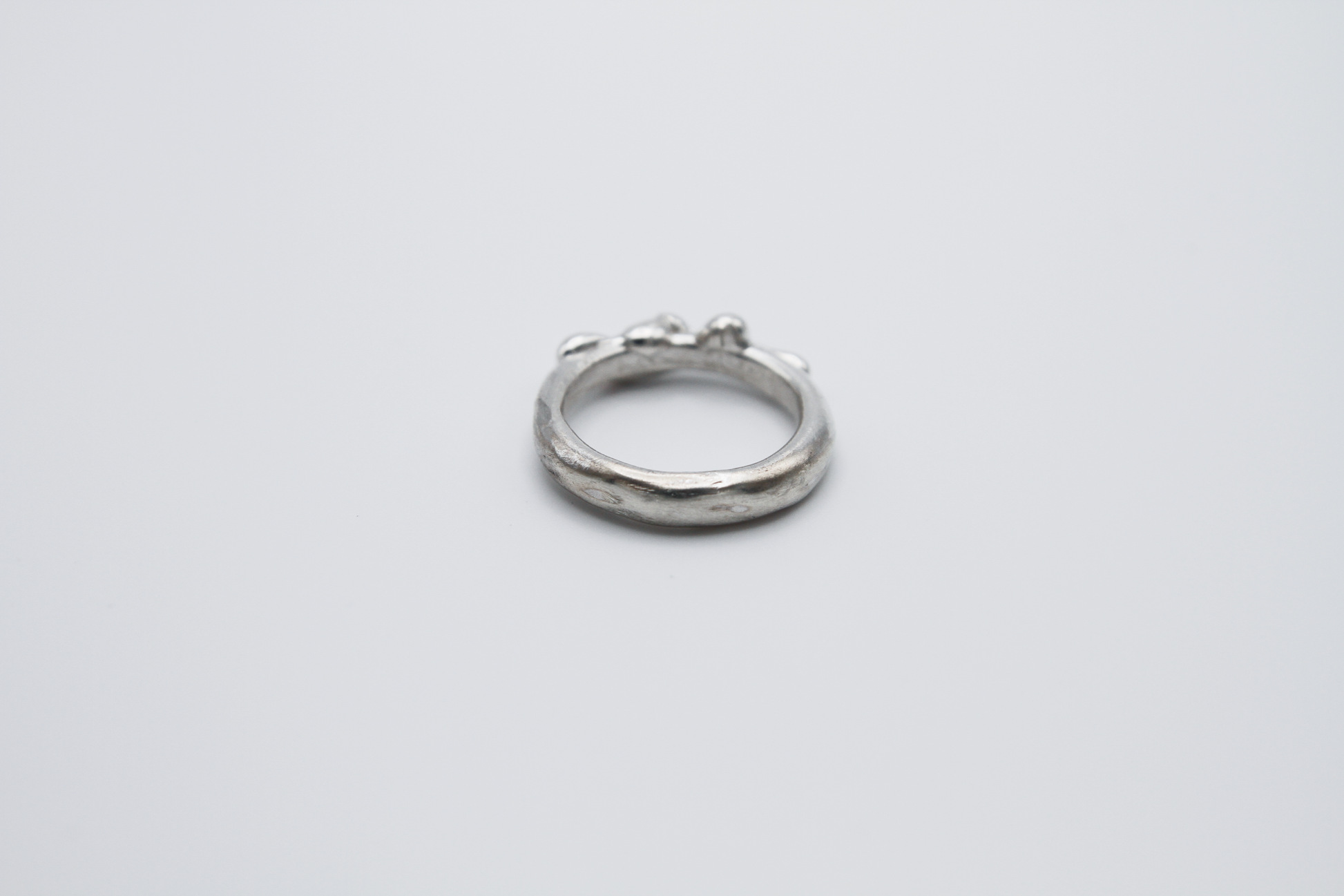 The Treacle Ring Band. 925 Solid Sterling Silver Ring band hand made in the United Kingdom. This ring has a melted look to it, driping sterling silver on the ring face. For all genders and ring sizes.