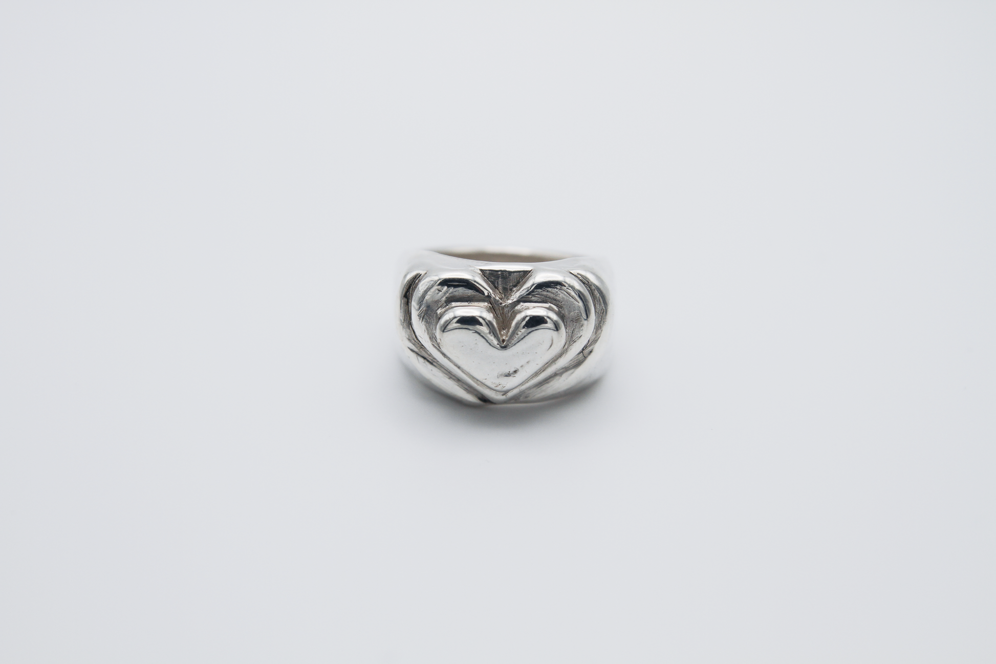 The Hill of Hearts Ring. 925 Solid Sterling Silver Chunky Ring hand made in the United Kingdom. This ring is made up of 3 tiers in a heart shape carved by hand from wax and then cast into sterling silver. For all genders and ring sizes.