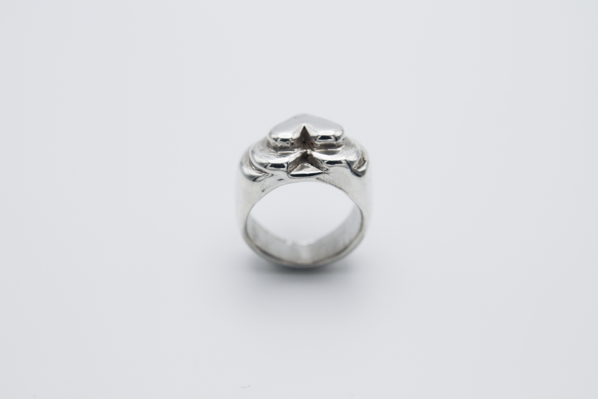 The Hill of Hearts Ring. 925 Solid Sterling Silver Chunky Ring hand made in the United Kingdom. This ring is made up of 3 tiers in a heart shape carved by hand from wax and then cast into sterling silver. For all genders and ring sizes.