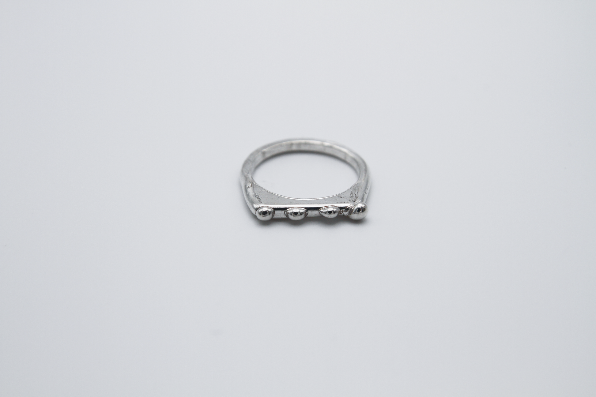 The Dew Drop Signet Ring Stack. 925 Solid Sterling Silver Chunky Ring band hand made in the United Kingdom. These stacking rings fashion blobs and drops of sterling silver in a bespoke and organic deisgn. Stack these three rings however you like, to be worn together or separately. For all genders and ring sizes.