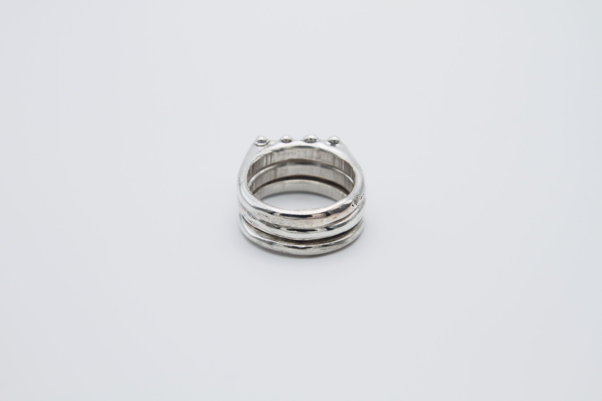 The Dew Drop Signet Ring Stack. 925 Solid Sterling Silver Chunky Ring band hand made in the United Kingdom. These stacking rings fashion blobs and drops of sterling silver in a bespoke and organic deisgn. Stack these three rings however you like, to be worn together or separately. For all genders and ring sizes.